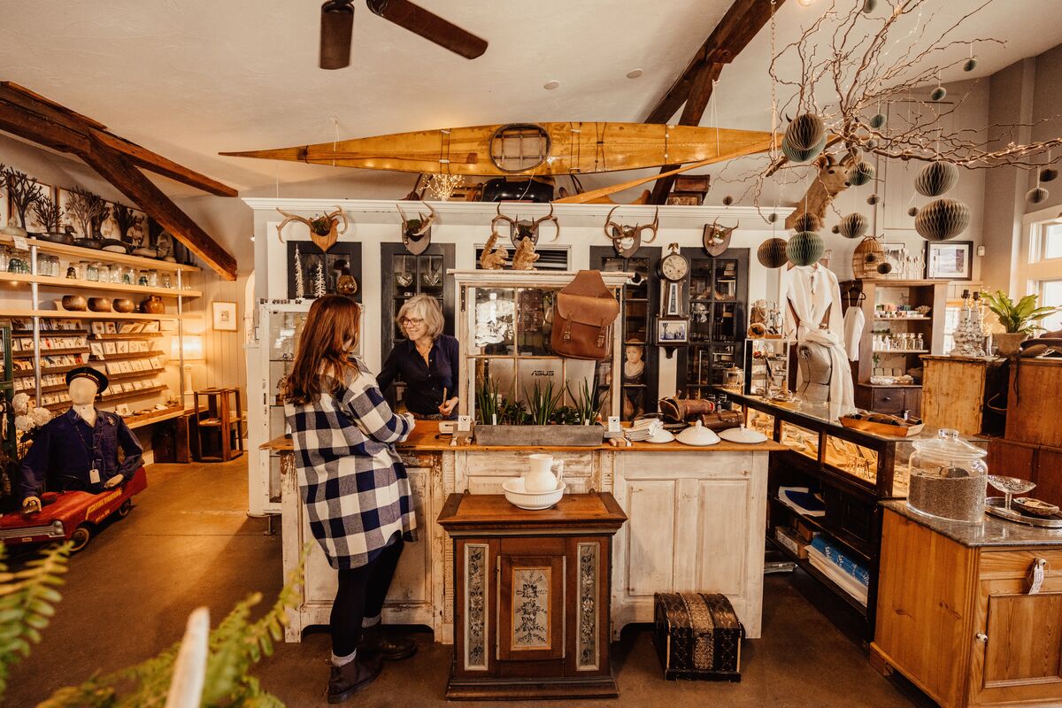 Girl checking out at Antique shop 