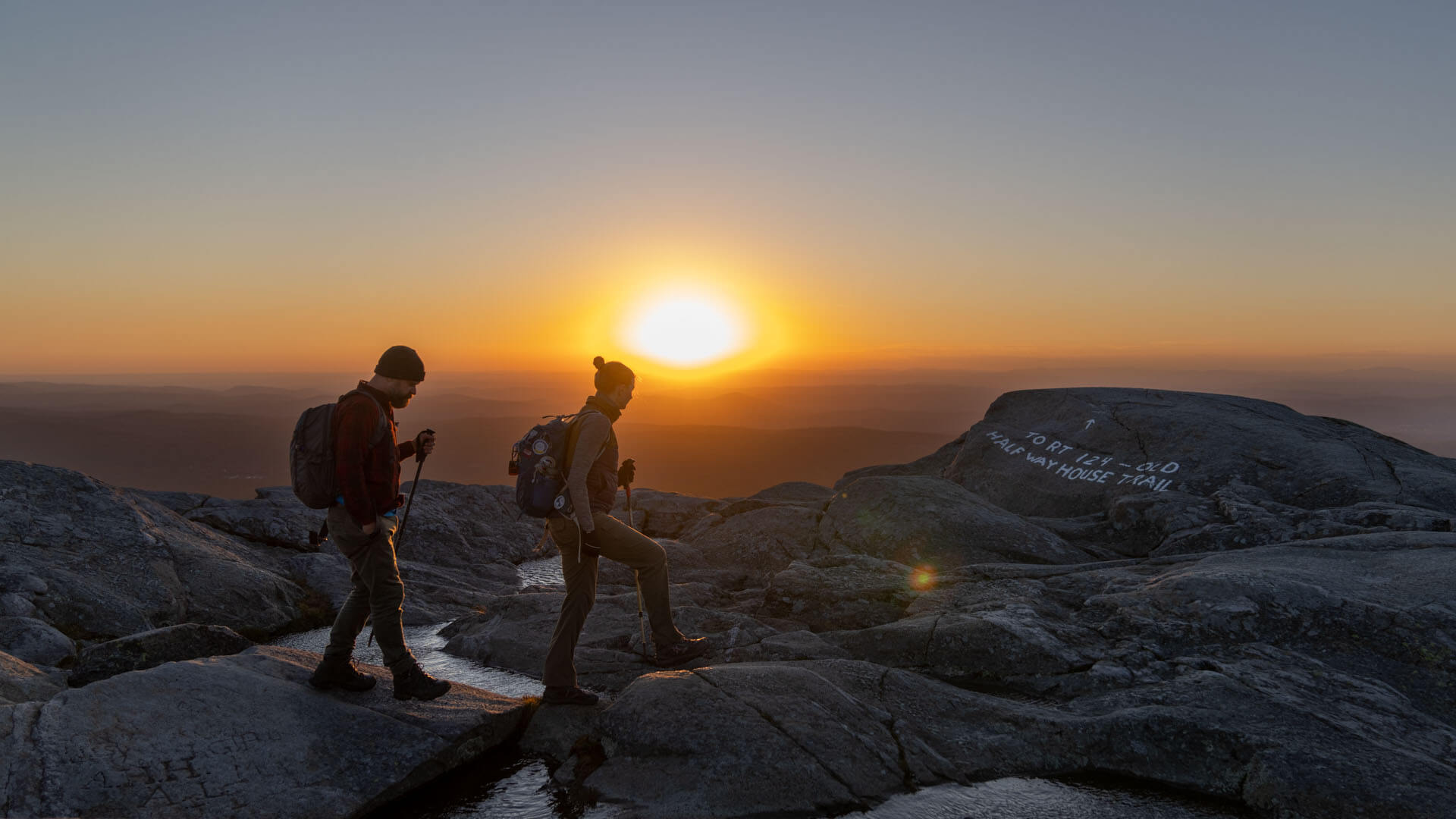 Two hikers on top of Mount Monadnock