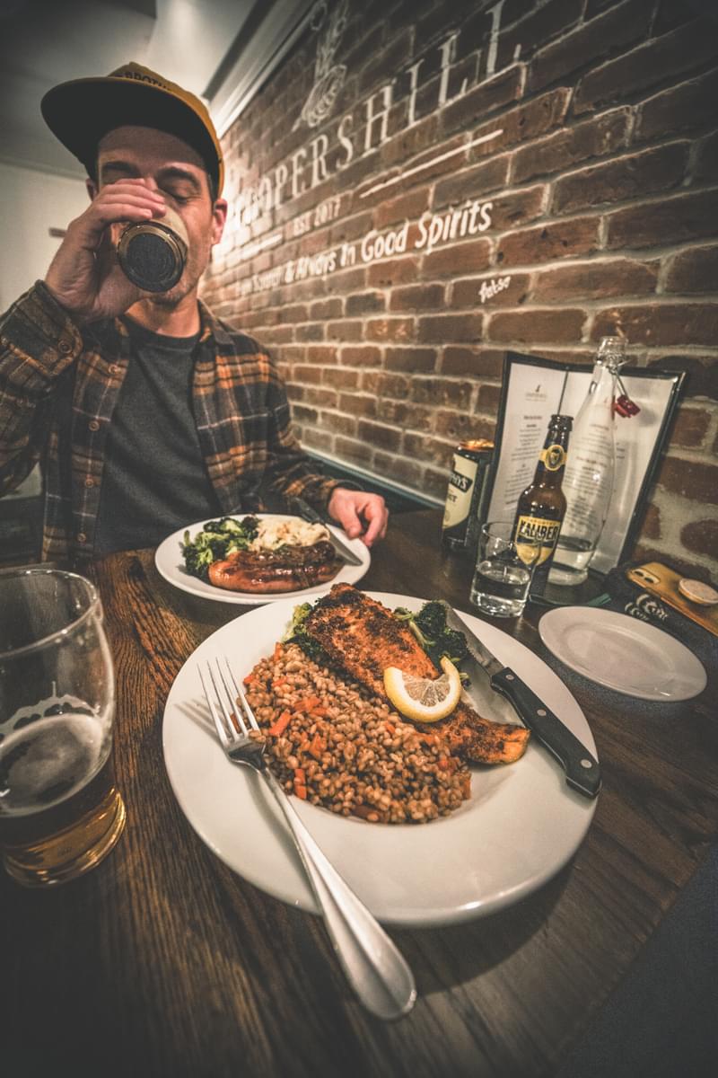 Diners enjoying dinner and beer at Cooper's Hill