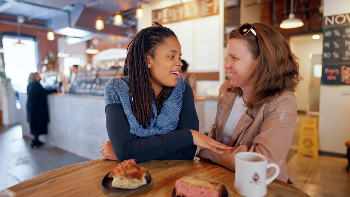 A couple enjoys coffee and snacks at Brewbakers