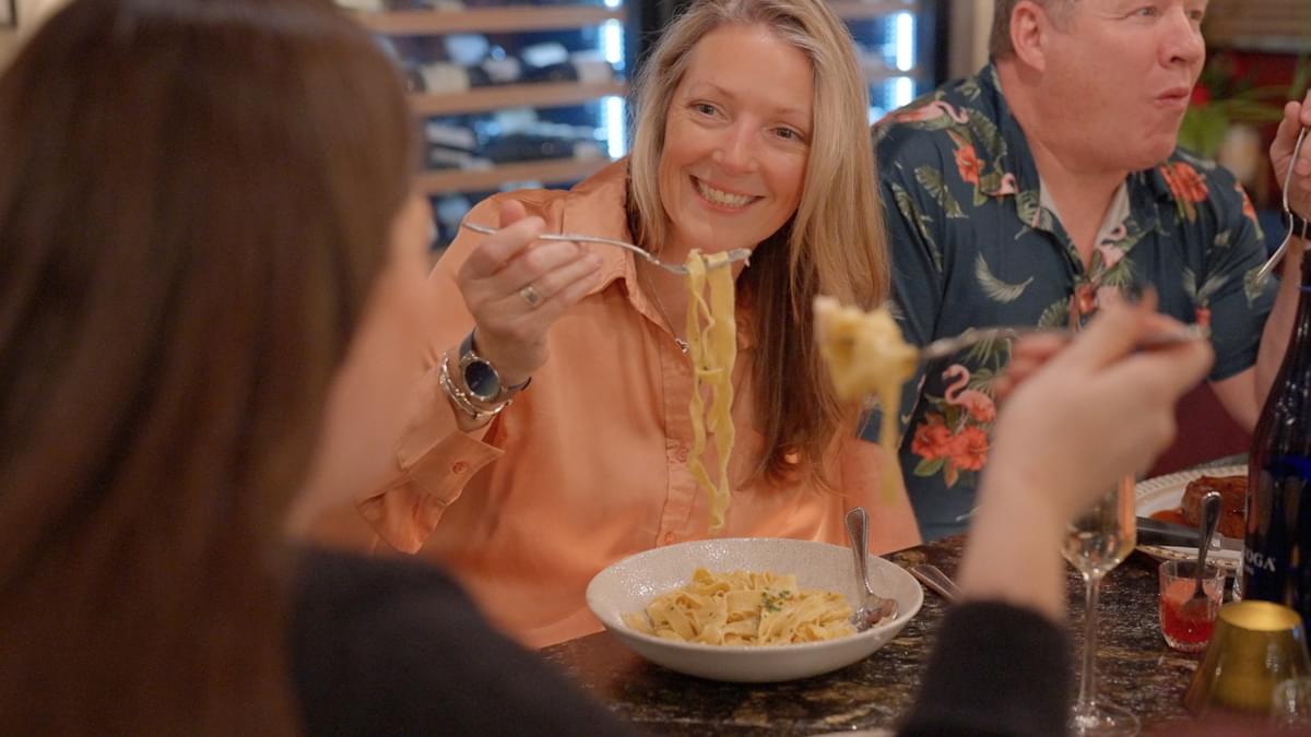 Woman enjoying fresh pasta at Granita Enoteca in Keene, NH