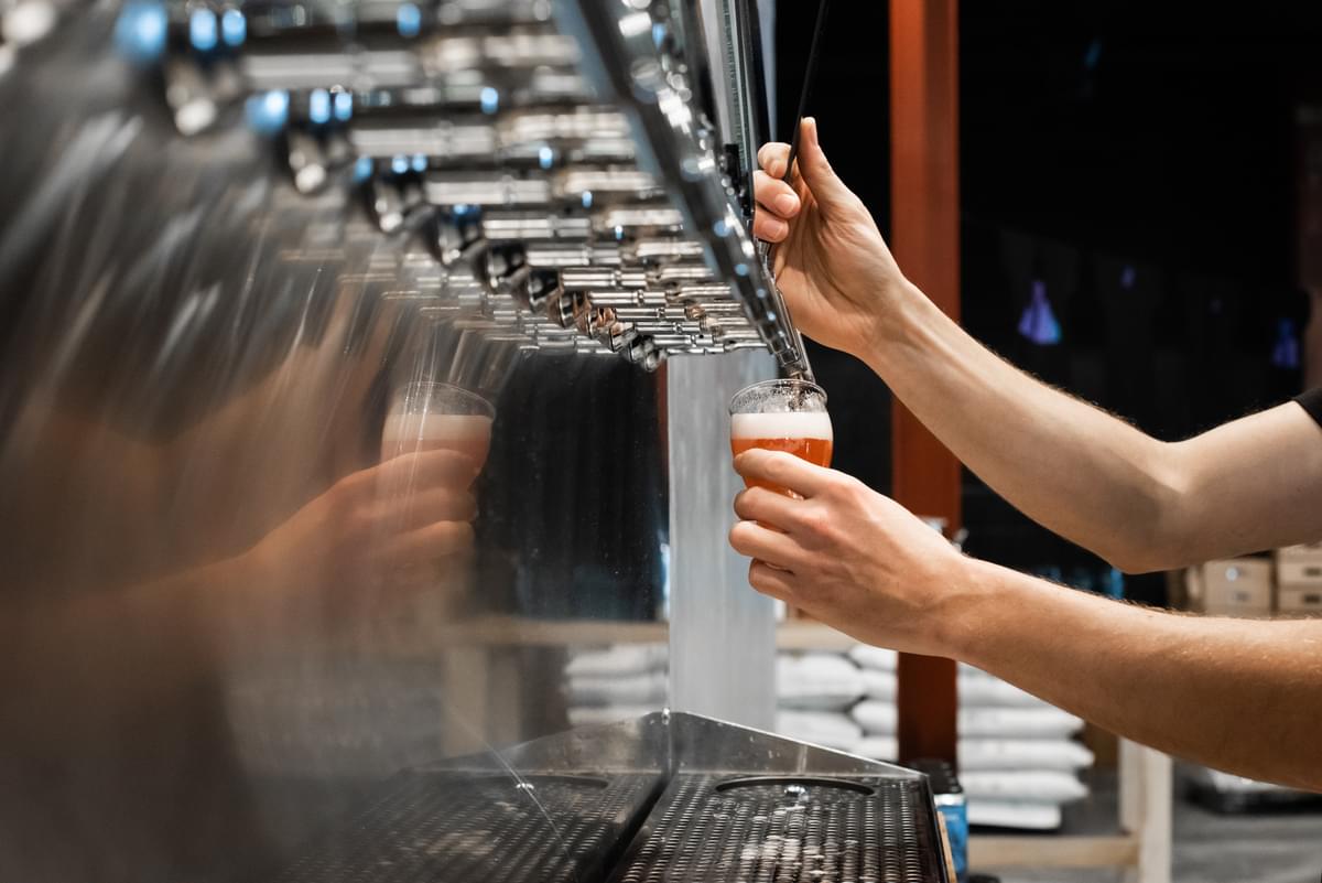 Person pouring a pint